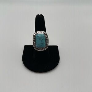Beautiful Silver with Turquoise colored stone.